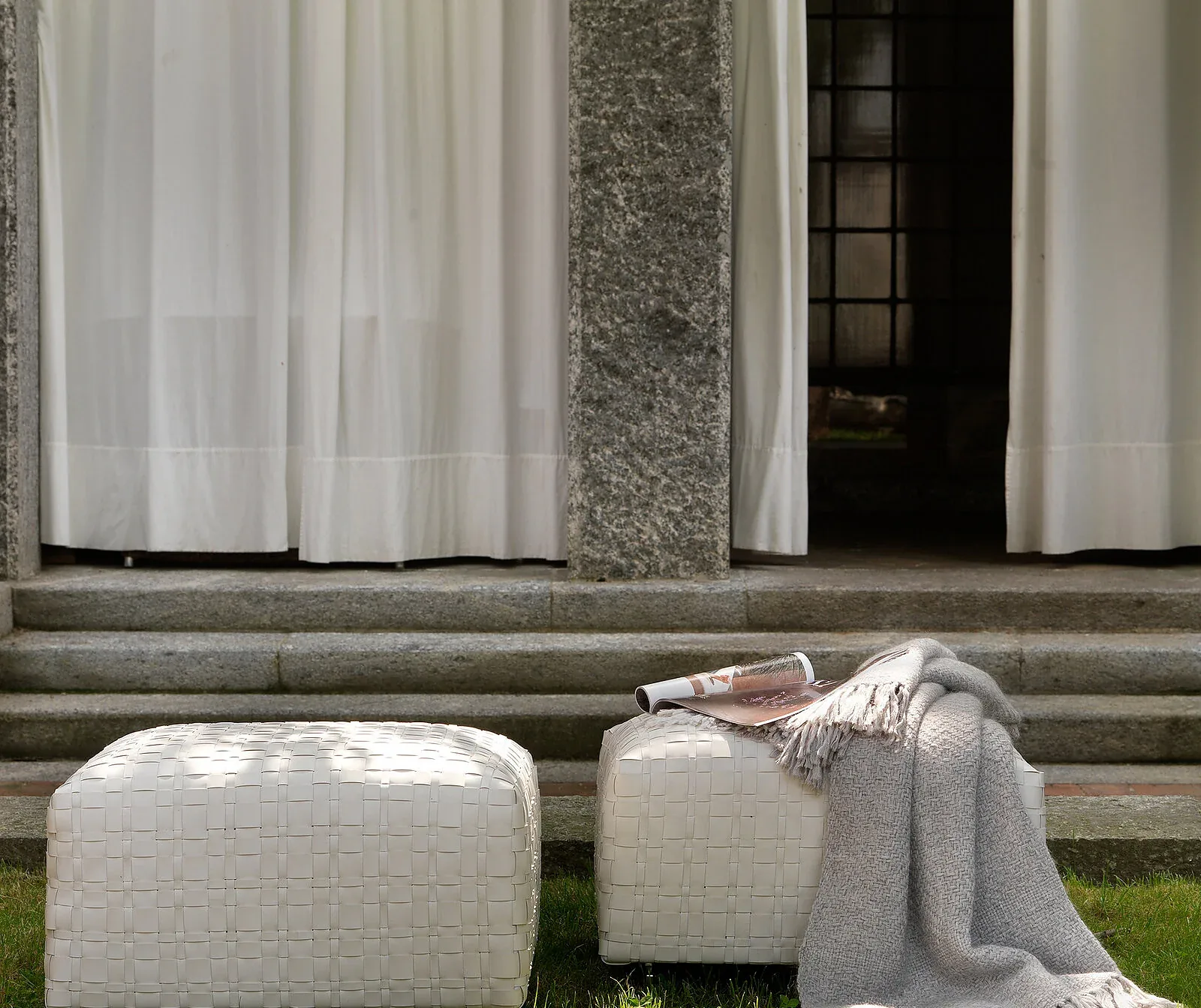 Flexform Bangkok outdoor ottoman in a garden setting, frame 1