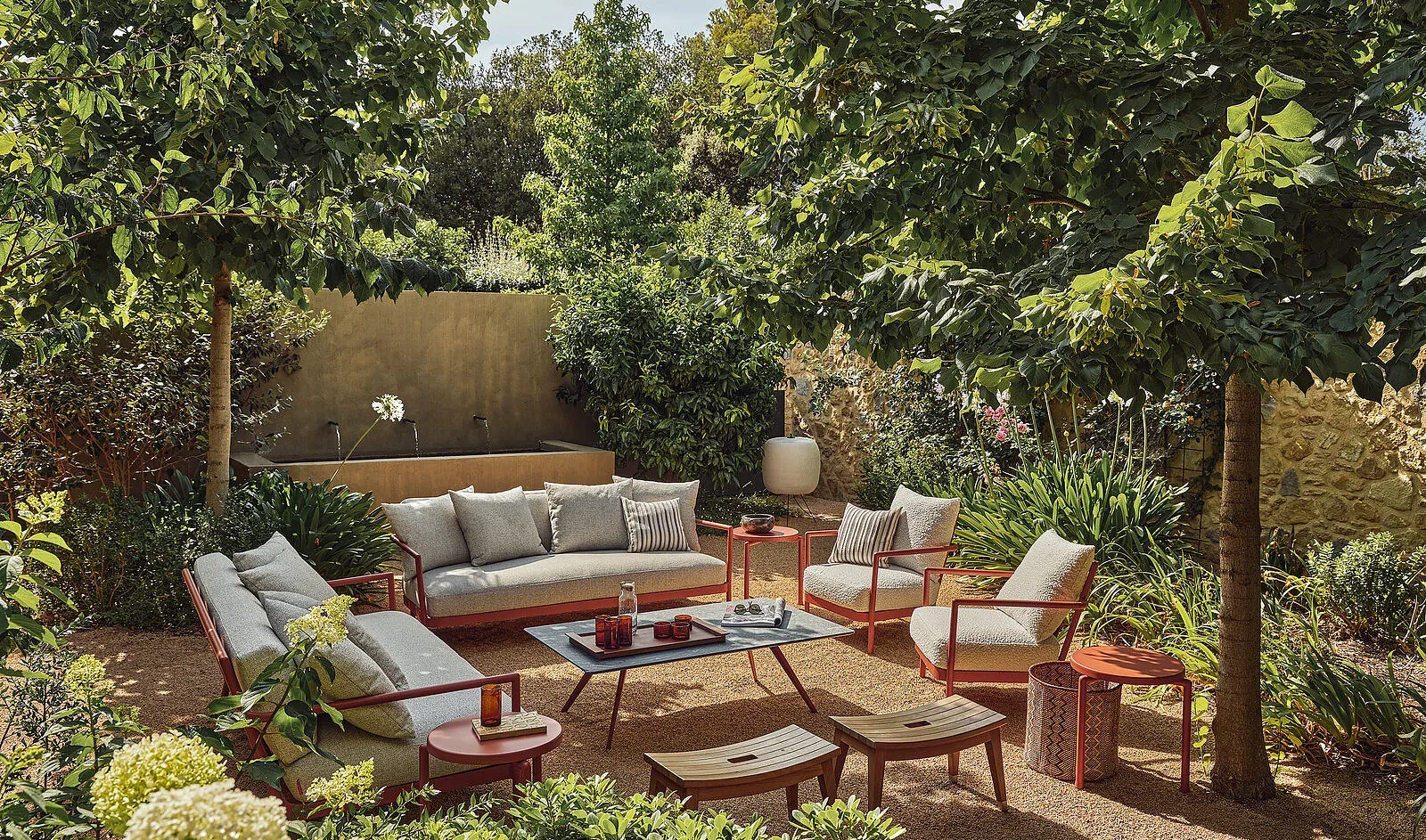 Flexform Camargue outdoor sofa in a garden setting, frame 1