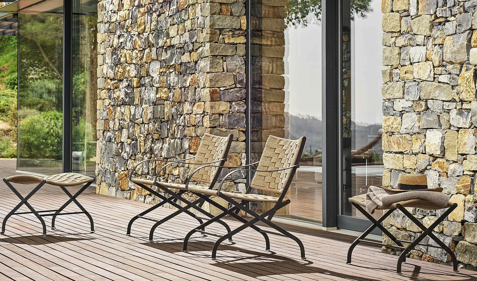 Flexform Carlotta outdoor armchair on a terrace