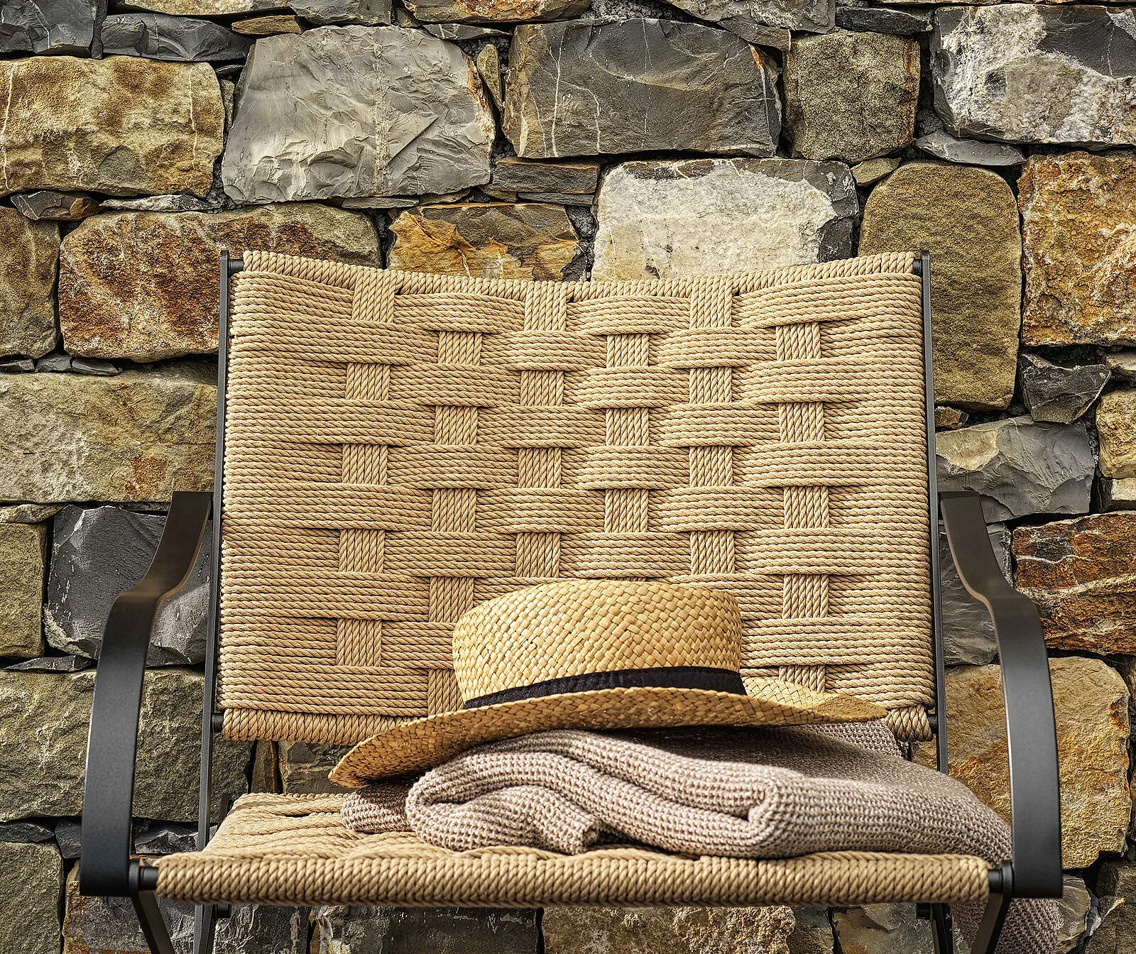 Flexform Carlotta outdoor armchair in a garden setting, frame 1
