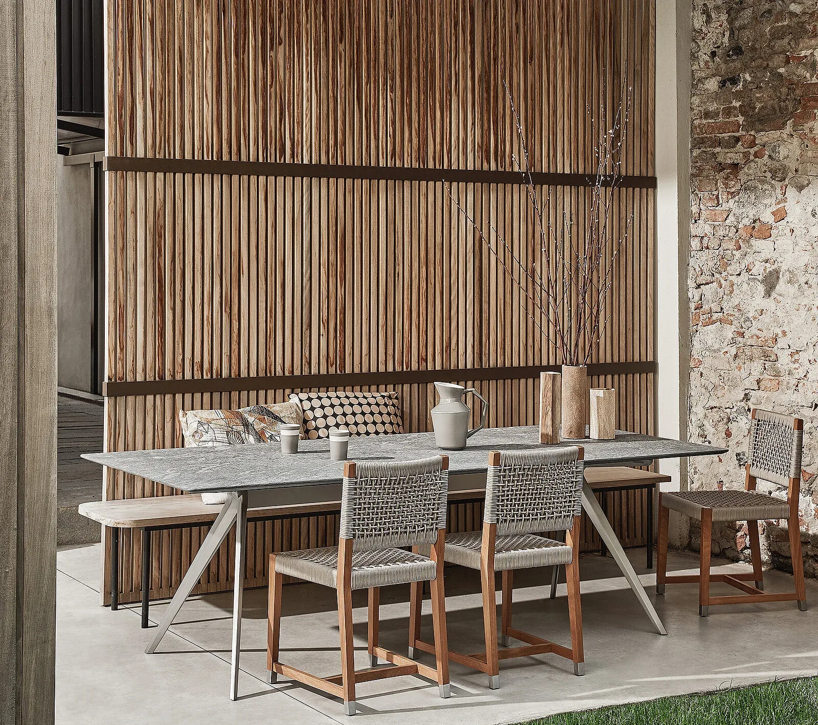 Flexform Dafne outdoor chair in a garden setting, frame 2