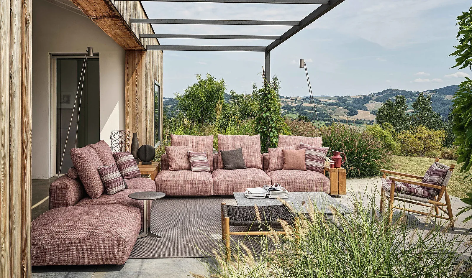 Flexform Grandemare outdoor sofa in a garden setting, frame 1