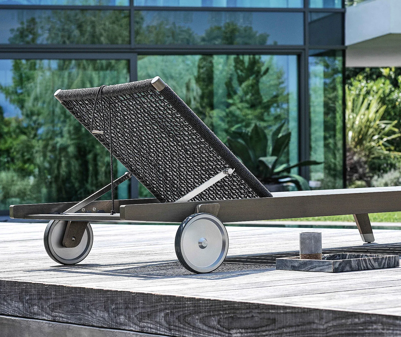 Flexform Hora Sexta outdoor daybed in a garden setting, frame 3