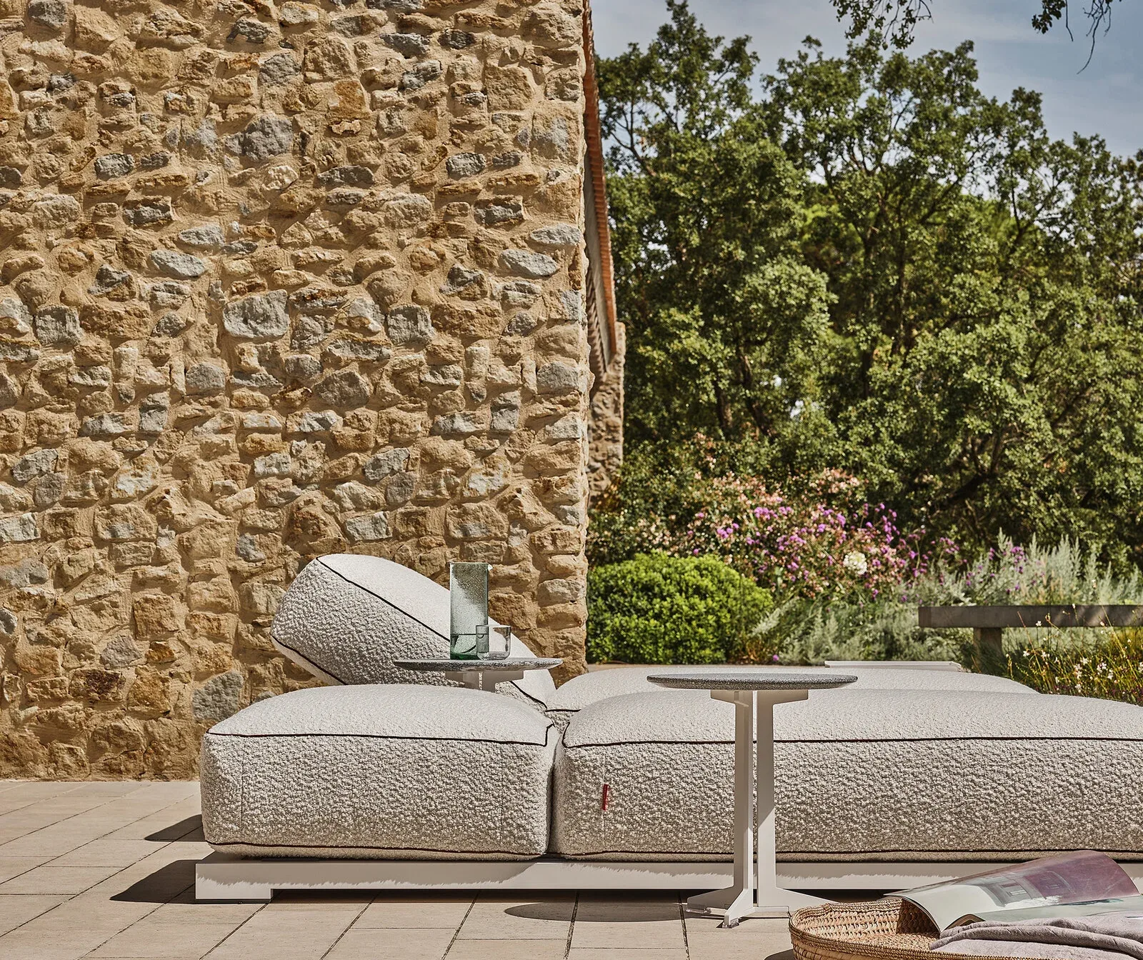 Flexform Milos outdoor daybed in a garden setting, frame 2