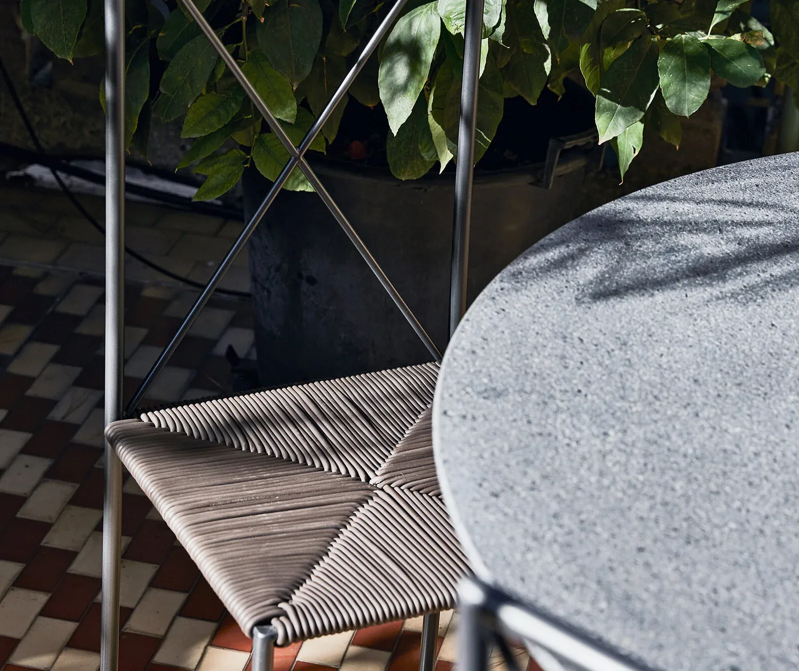 Flexform Moka outdoor chair in a garden setting, frame 3