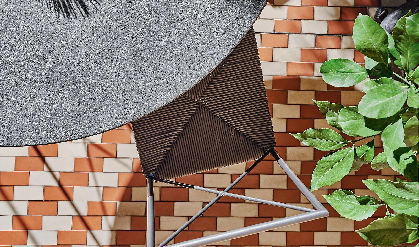 Flexform Moka outdoor chair in a garden setting, frame 1