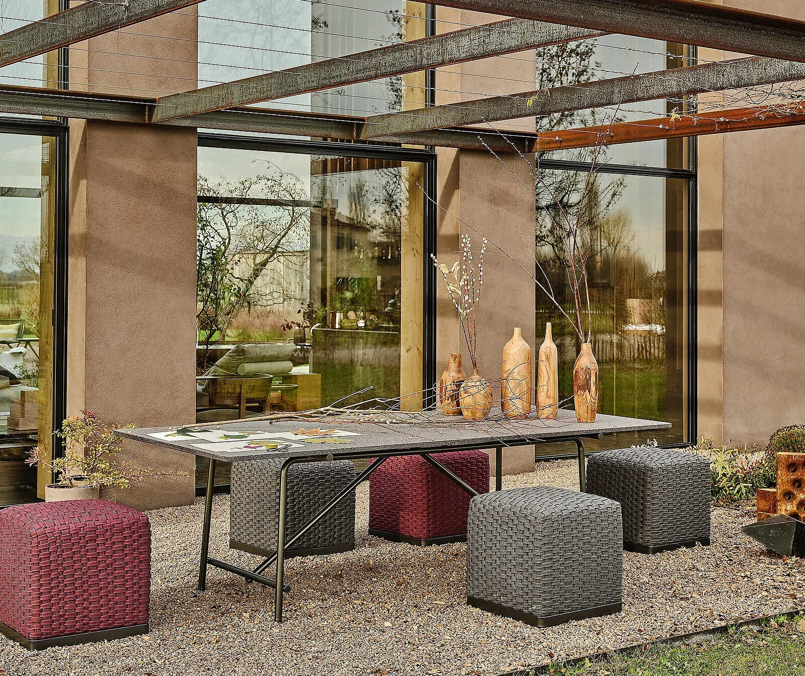 Flexform Phuket outdoor ottoman in a garden setting, frame 3