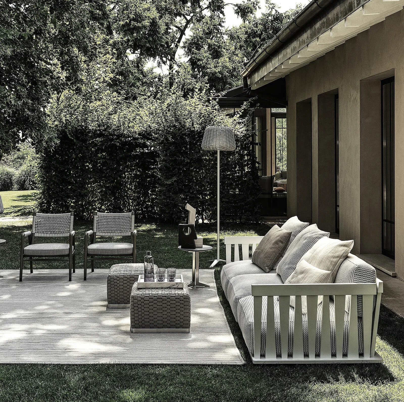 Flexform Zante outdoor sofa in a garden setting, frame 2